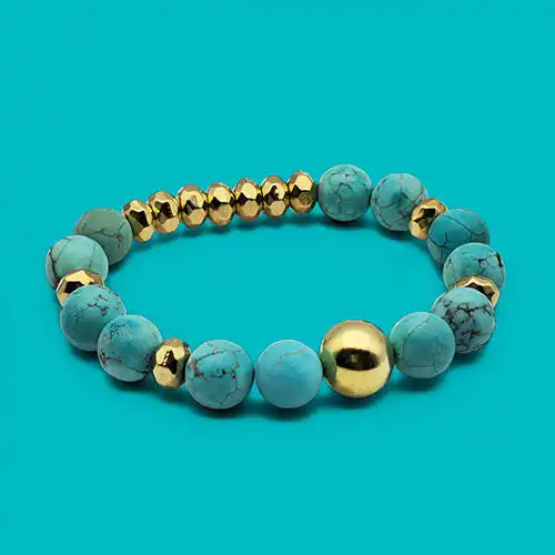 A beaded bracelet with alternating turquoise and gold-colored beads.