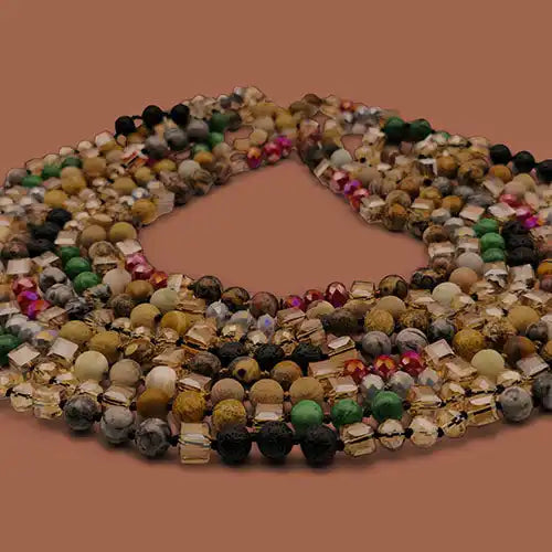 A collection of multi-strand beaded necklaces featuring a mix of round and square beads in various earthy and iridescent colors.