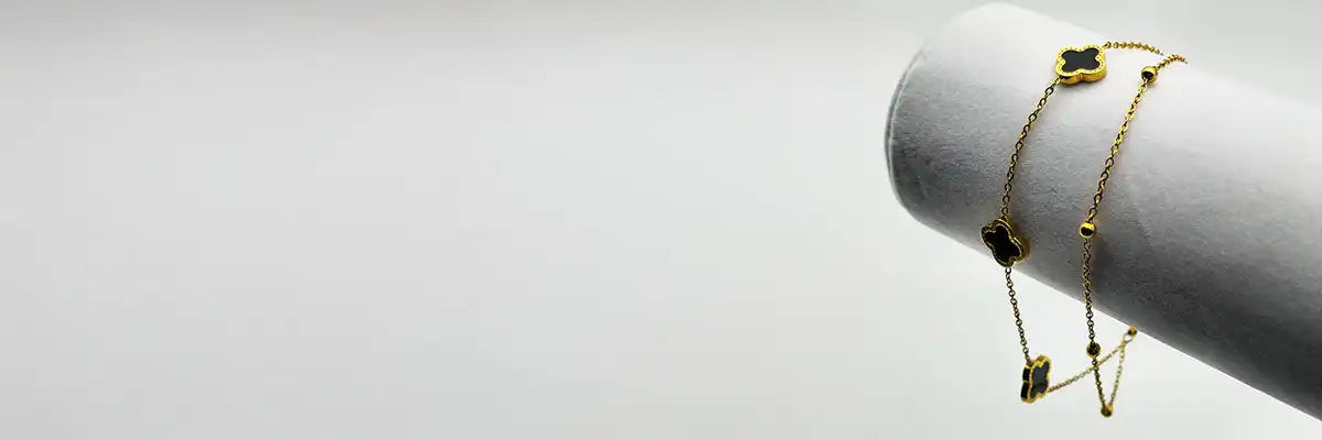 Gold clover charm bracelet.