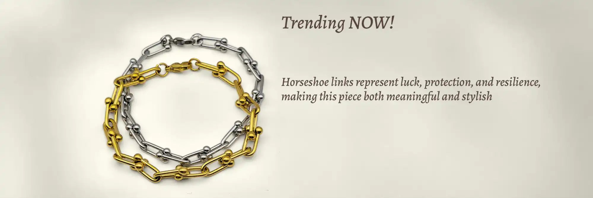 Gold and silver horseshoe link bracelets.