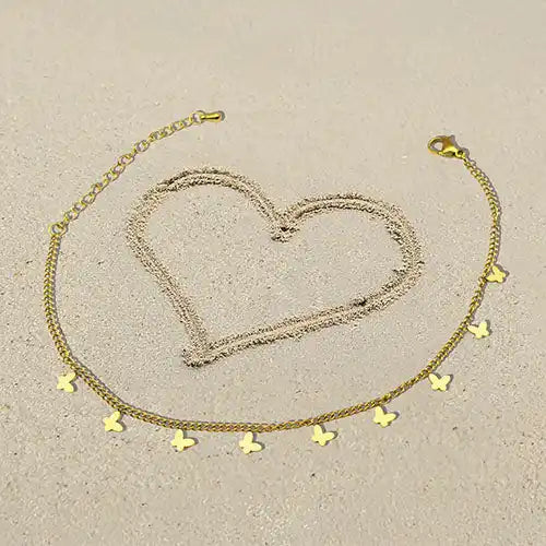 Gold-toned butterfly charm anklet.